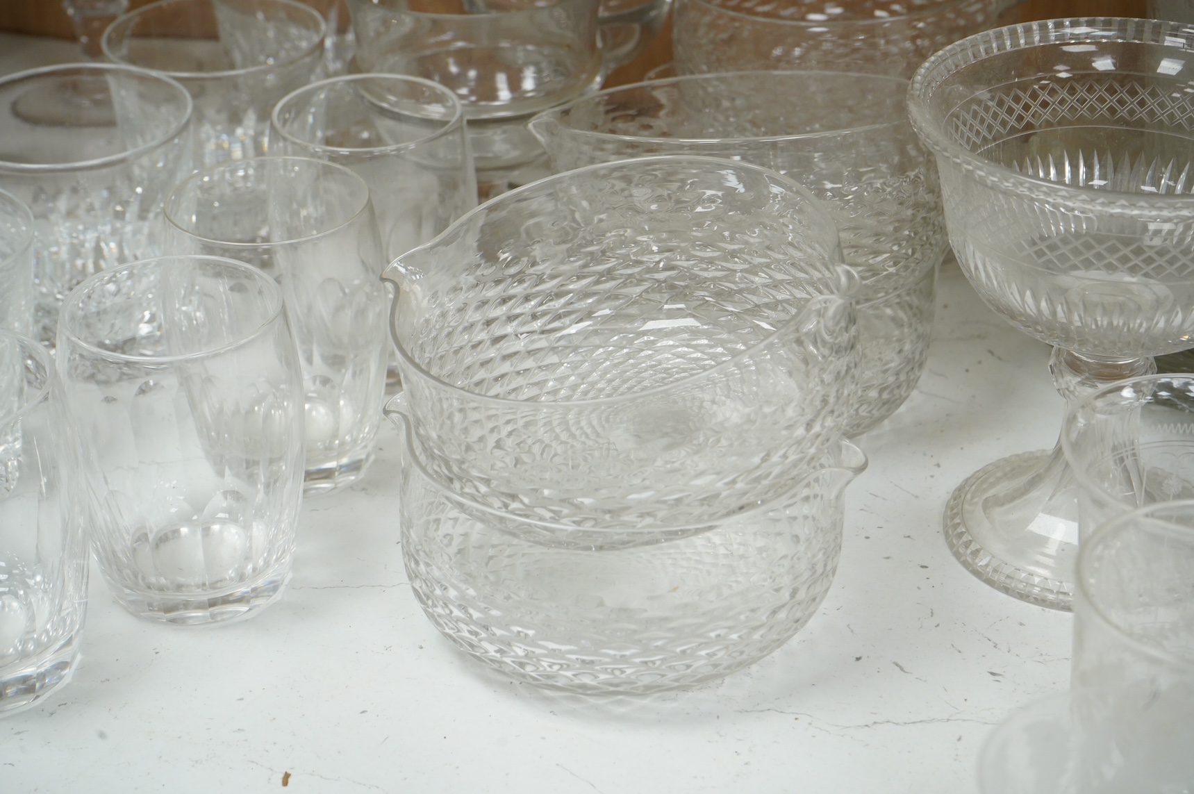 A collection of 19th century and later glassware, to include: Three fluted wine glasses two rummers, various risers and finger bows, decanters etc